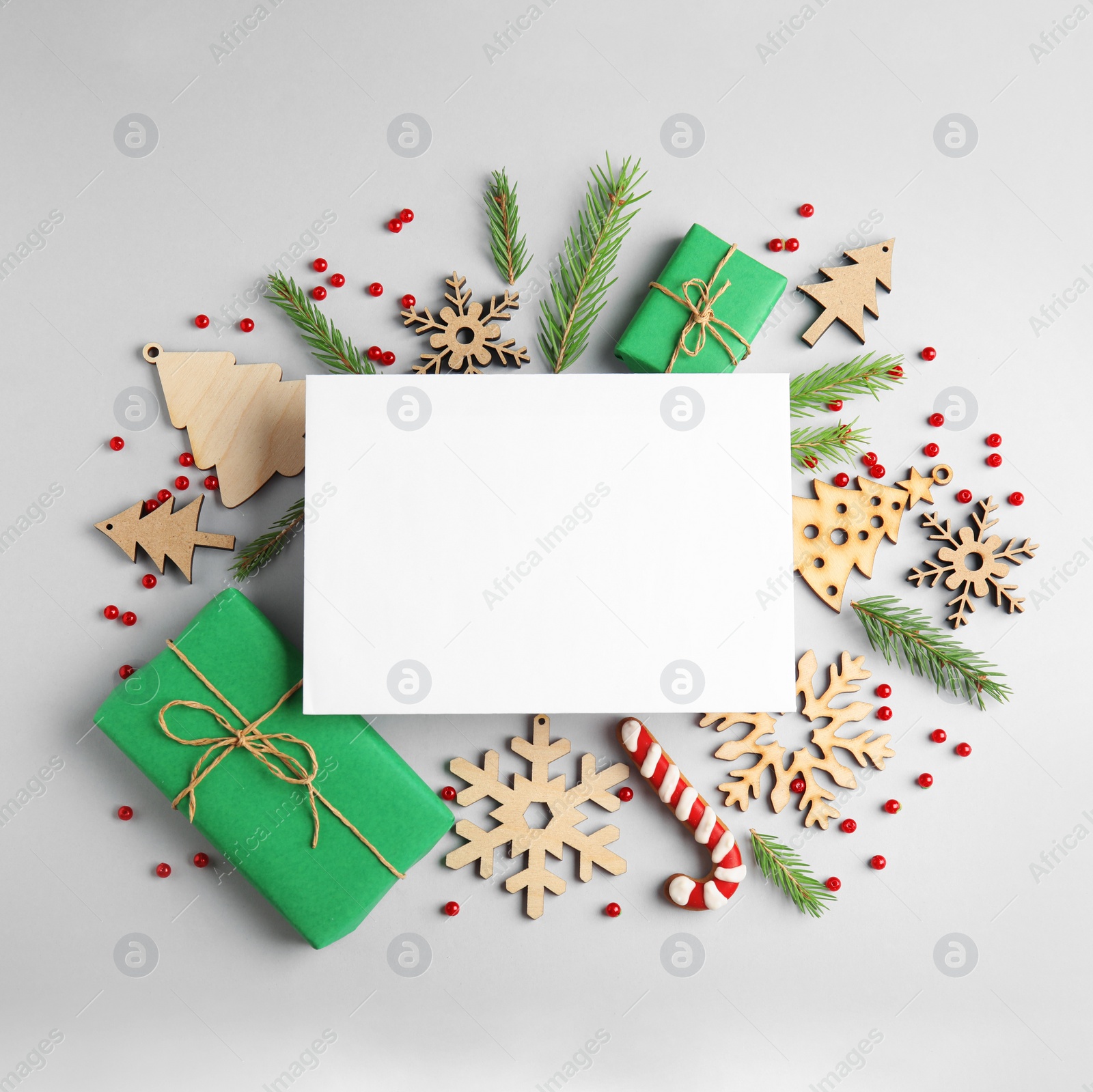 Photo of Composition with Christmas decor and blank card on white background, top view