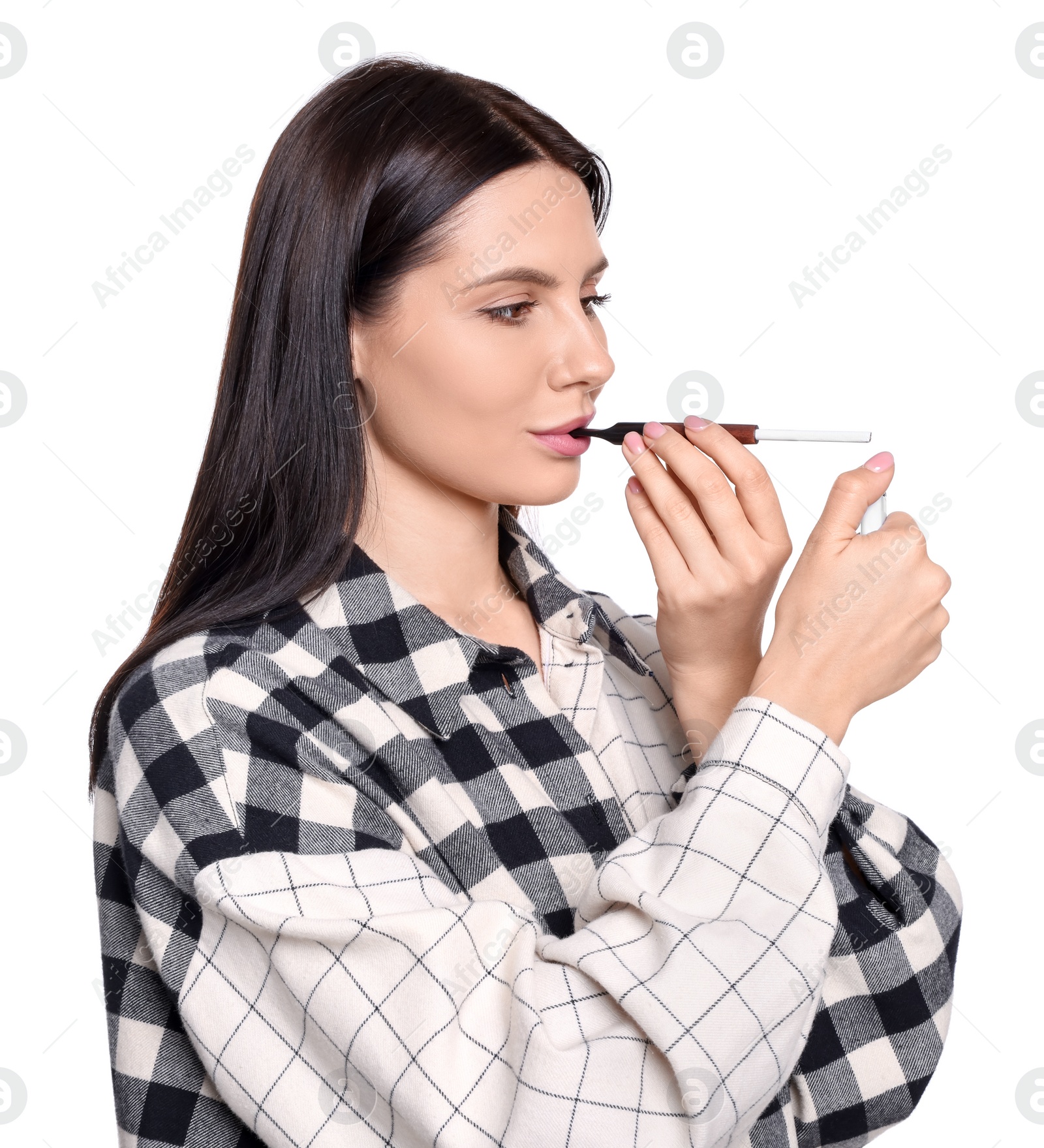 Photo of Woman using cigarette holder for smoking isolated on white