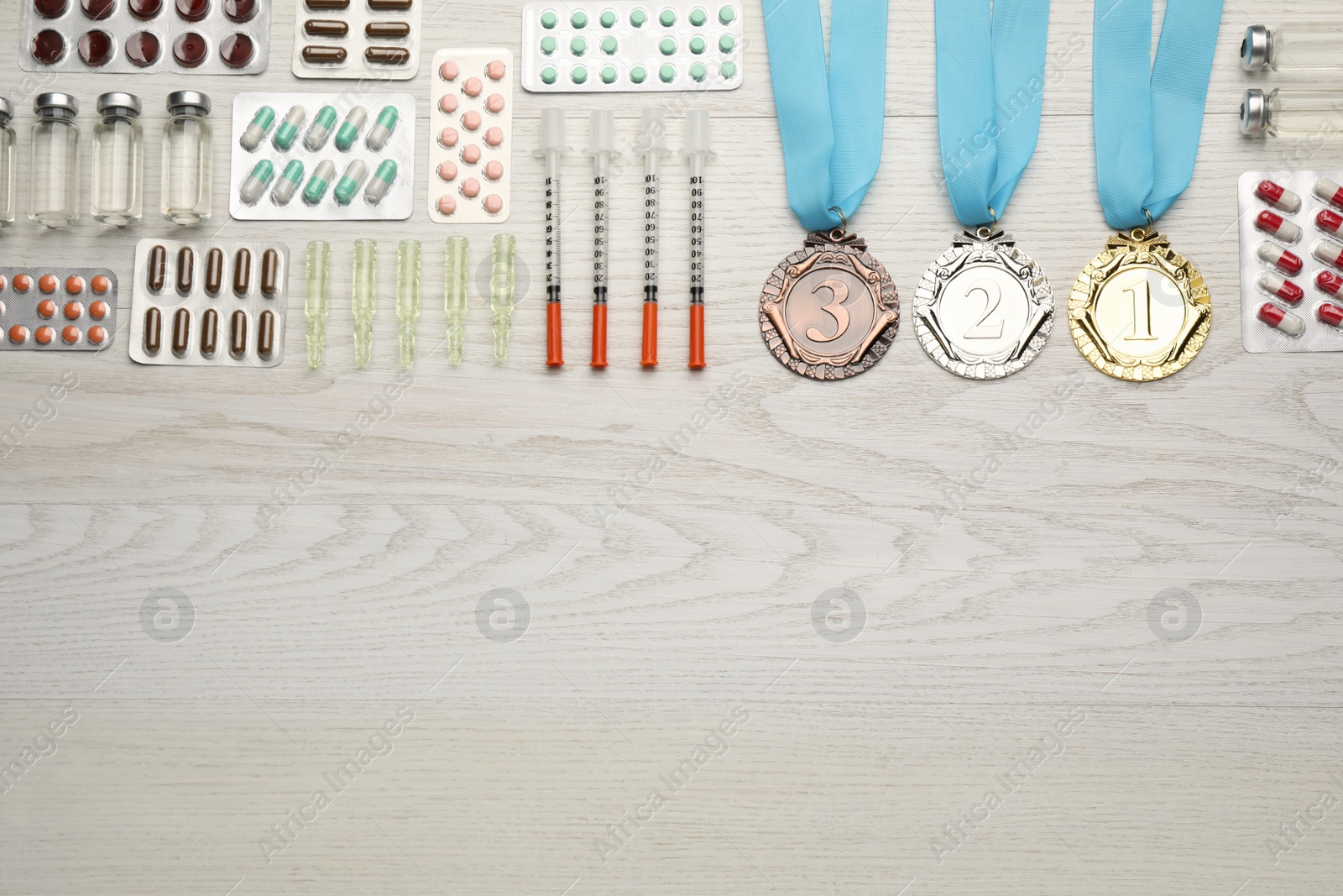 Photo of Flat lay composition with drugs on white wooden table, space for text. Doping control