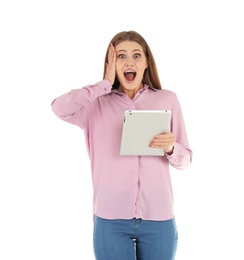 Emotional young woman with tablet celebrating victory on white background