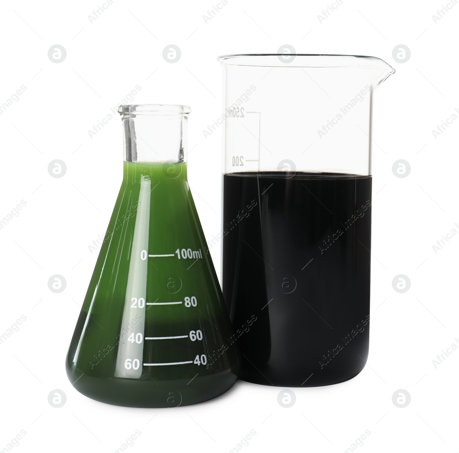 Photo of Beaker and flask with different types of crude oil isolated on white