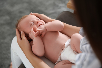 Photo of Mother with her newborn baby, closeup view