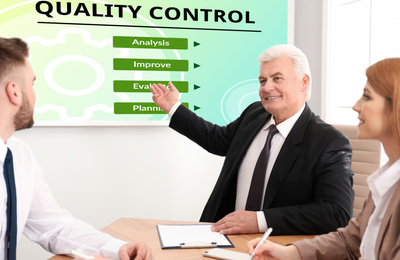 Business people having meeting about quality control