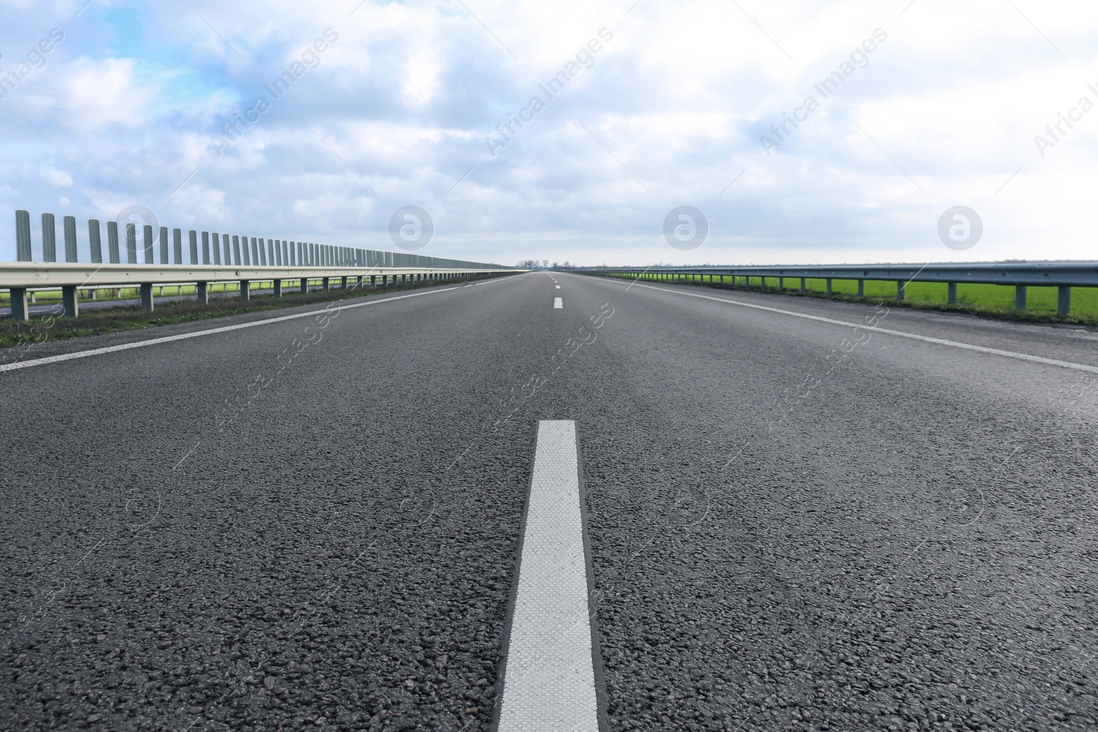 Photo of Beautiful view of asphalt highway without transport