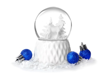 Magical snow globe with Christmas balls on white background