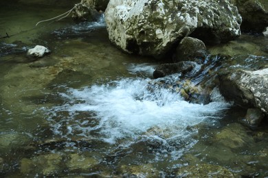 Photo of Picturesque landscape with stones and dripping stream