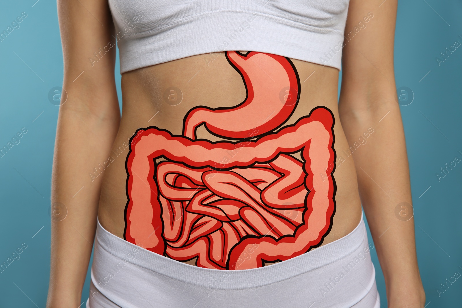 Image of Woman with image of healthy digestive system on blue background, closeup