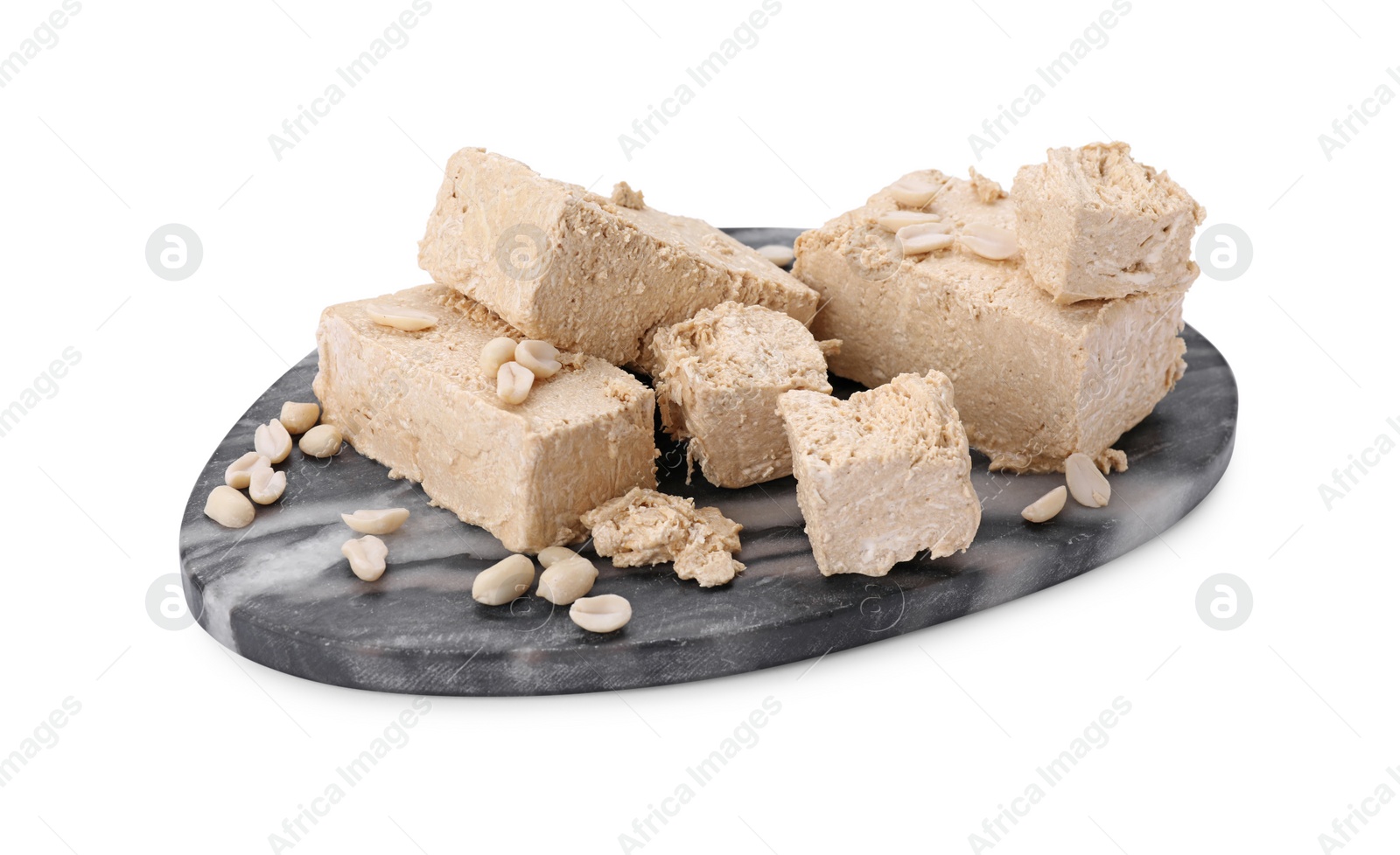 Photo of Pieces of tasty halva isolated on white