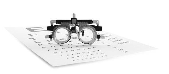 Photo of Eye chart test and trial frame on white background. Ophthalmologist tools