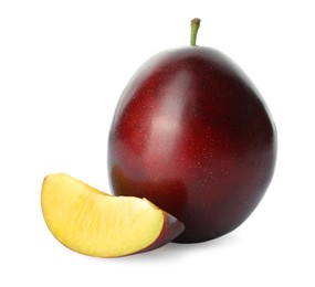 Whole and cut ripe plums on white background