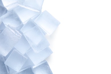 Photo of Many clear ice cubes on white background, top view