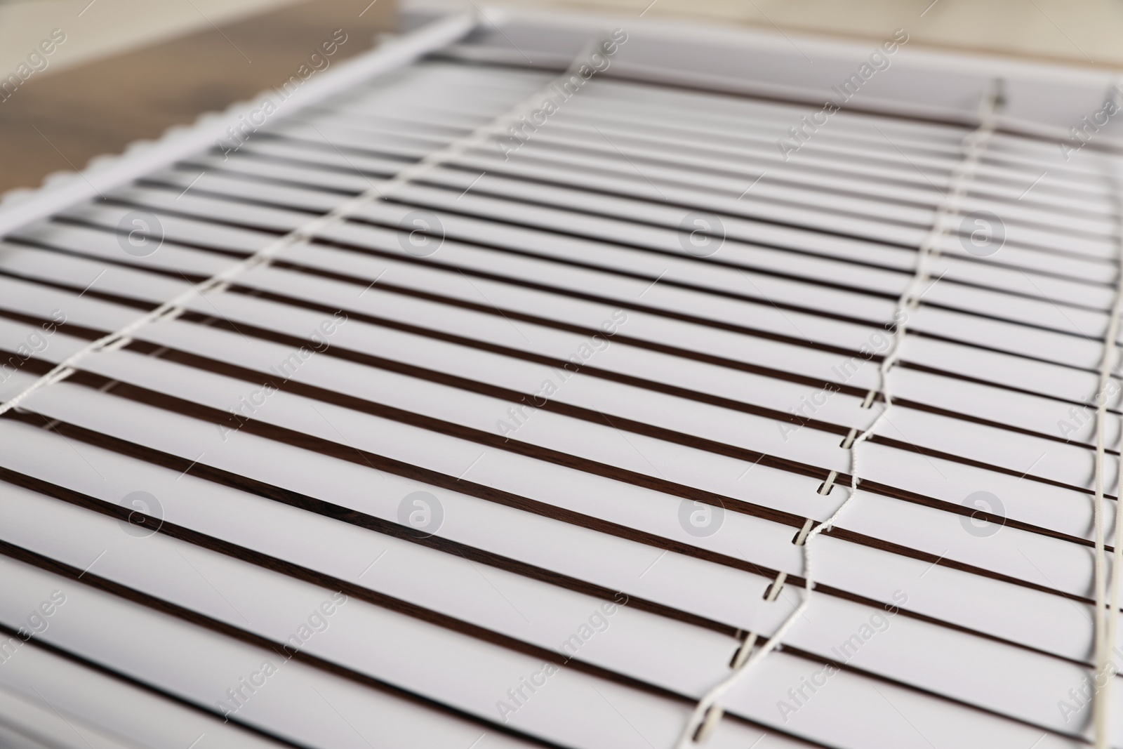 Photo of Closeup view of stylish horizontal window blinds