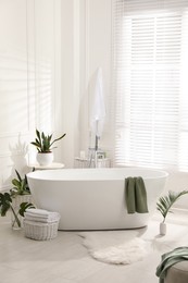 Stylish bathroom interior with green plants. Home design