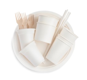 Set of disposable tableware on white background, top view