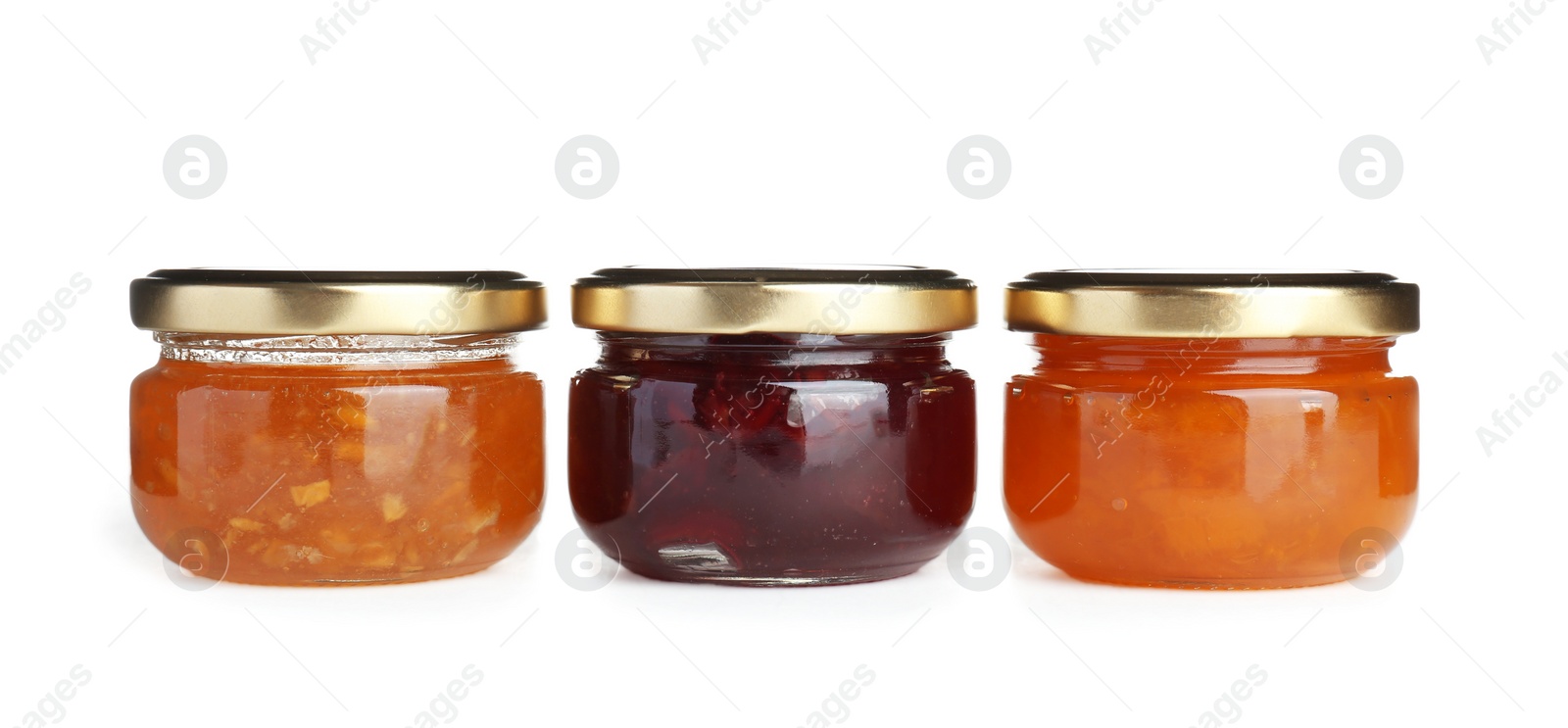 Photo of Three jars with tasty sweet jam on white background