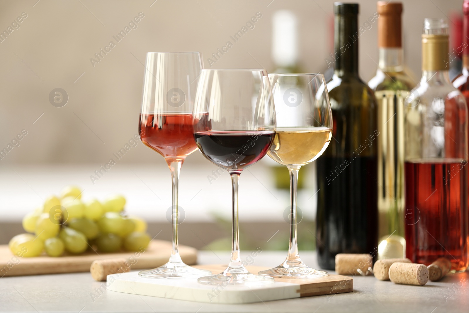 Photo of Different glasses with wine served on table