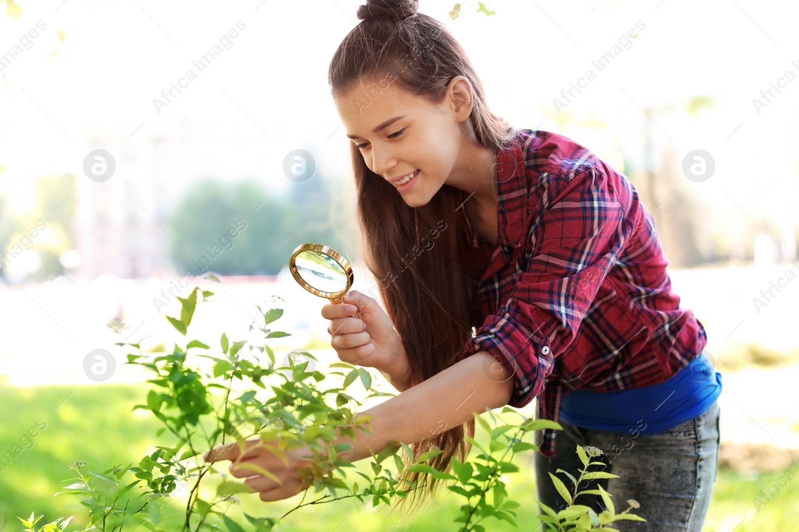 Photo of Teenage girl exploring bush outdoors. Summer camp