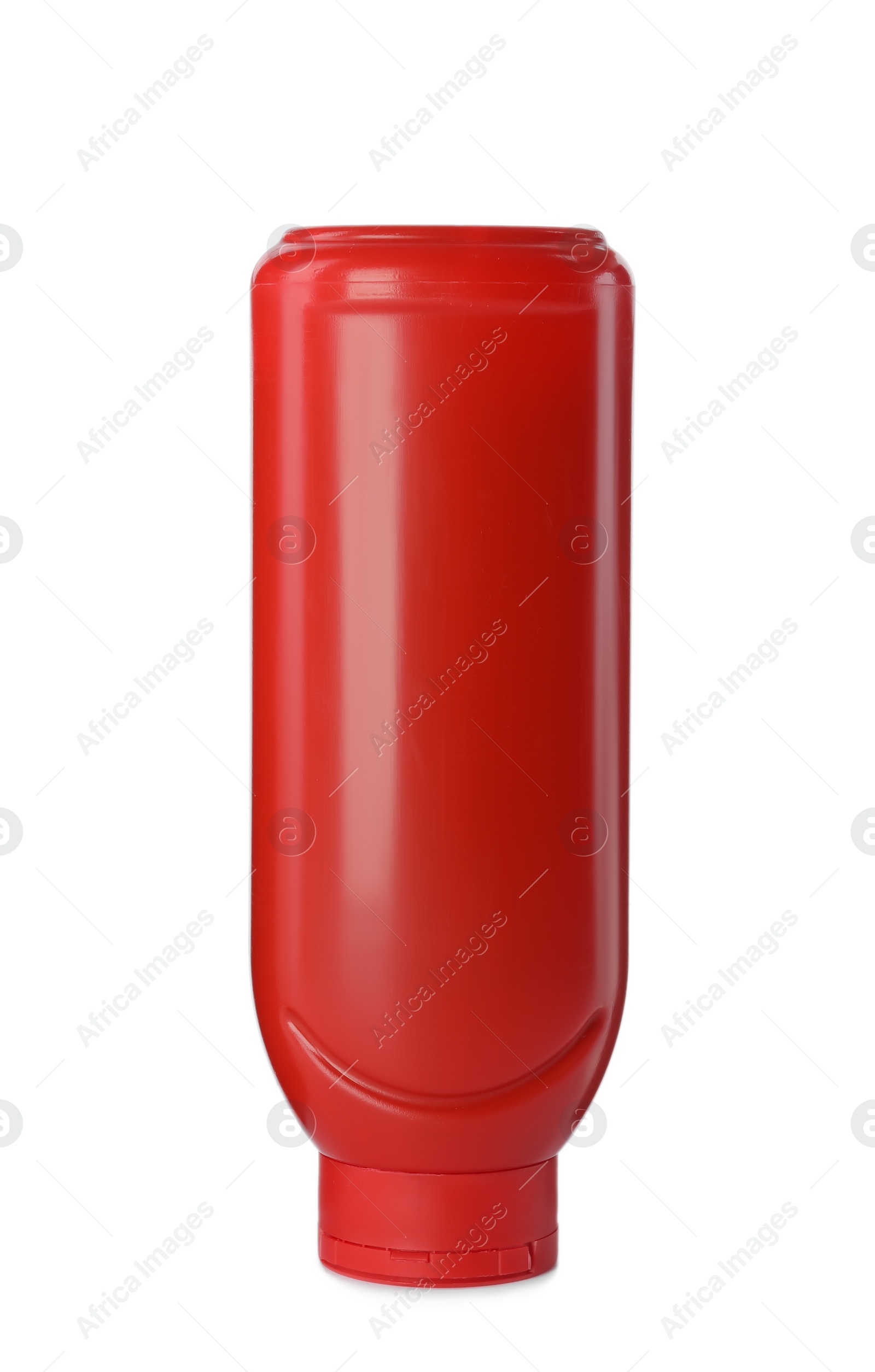 Photo of Red plastic ketchup bottle isolated on white