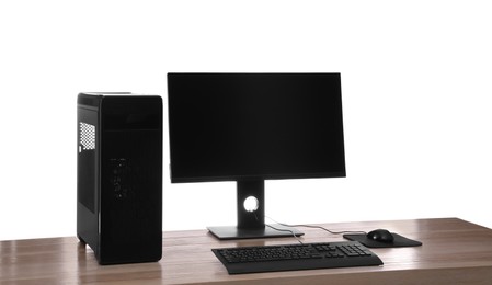 Photo of Modern computer with blank monitor screen and peripherals on wooden table against white background