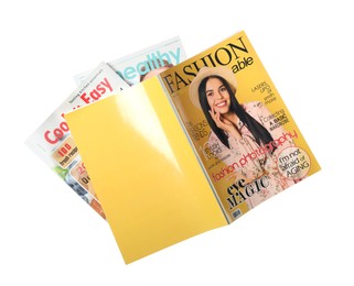 Photo of Stack of different magazines on white background, top view
