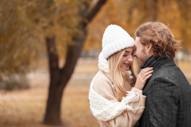 Photo of Young romantic couple in park on autumn day