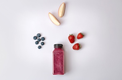 Photo of Flat lay composition with healthy detox smoothie and ingredients on light background