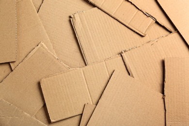 Pieces of cardboard as background, top view. Recycling concept