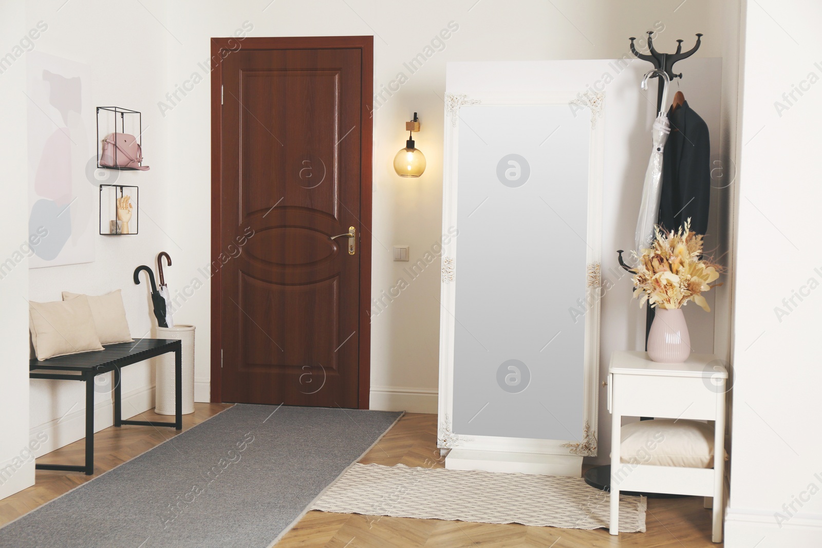 Photo of Modern hallway interior with stylish furniture and mirror