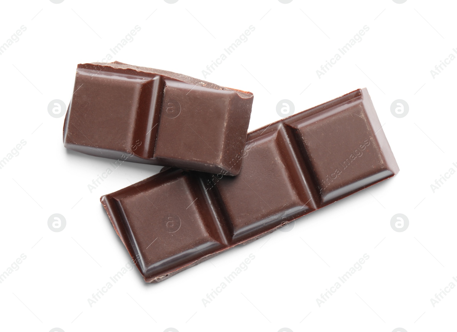 Photo of Pieces of delicious dark chocolate isolated on white, top view