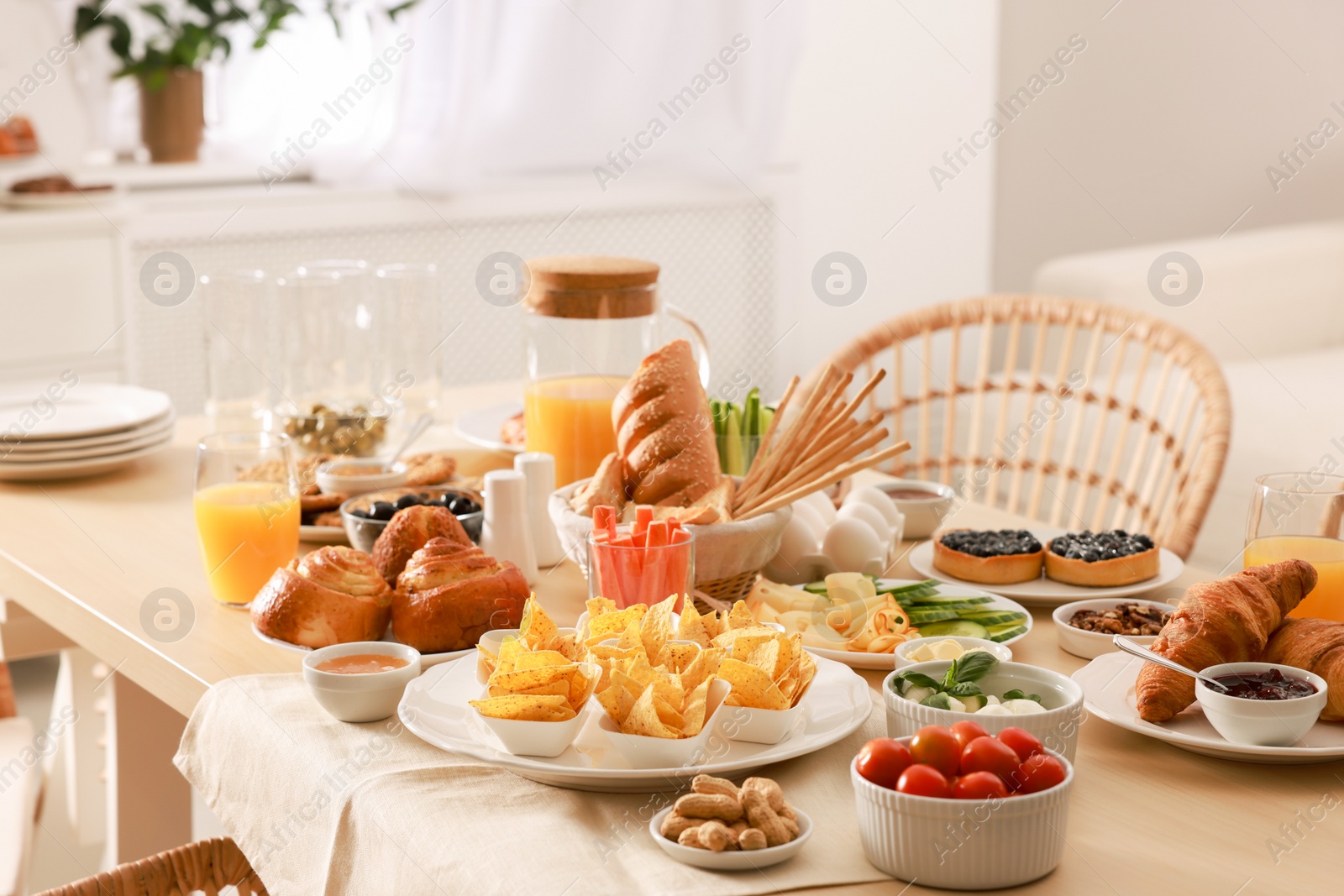 Photo of Dishes with different food on table in room. Luxury brunch