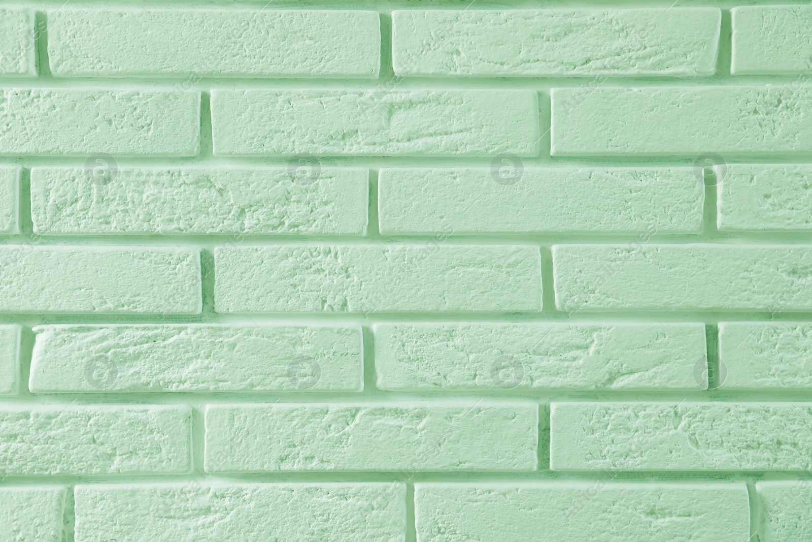 Image of Brick wall as background. Image toned in mint color 