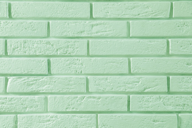 Image of Brick wall as background. Image toned in mint color 