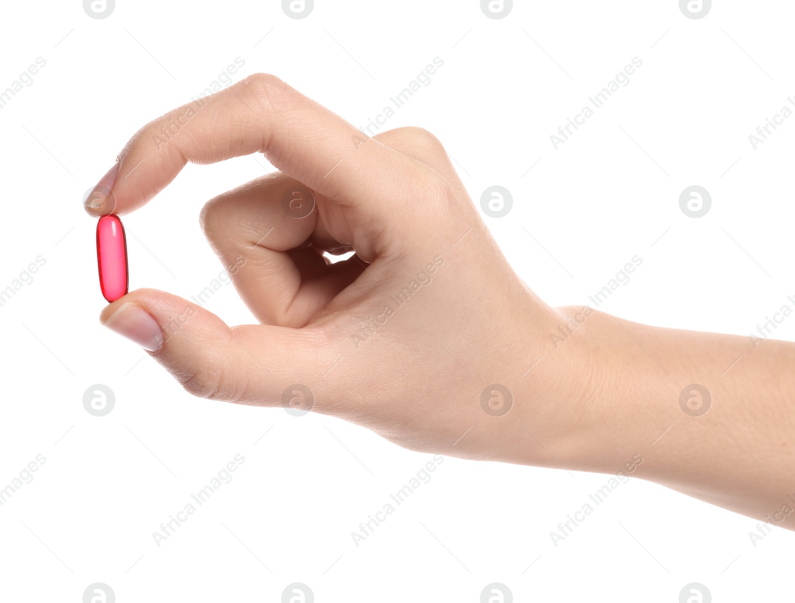 Photo of Woman holding color pill on white background, closeup