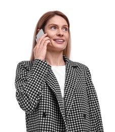 Beautiful happy businesswoman talking on smartphone against white background