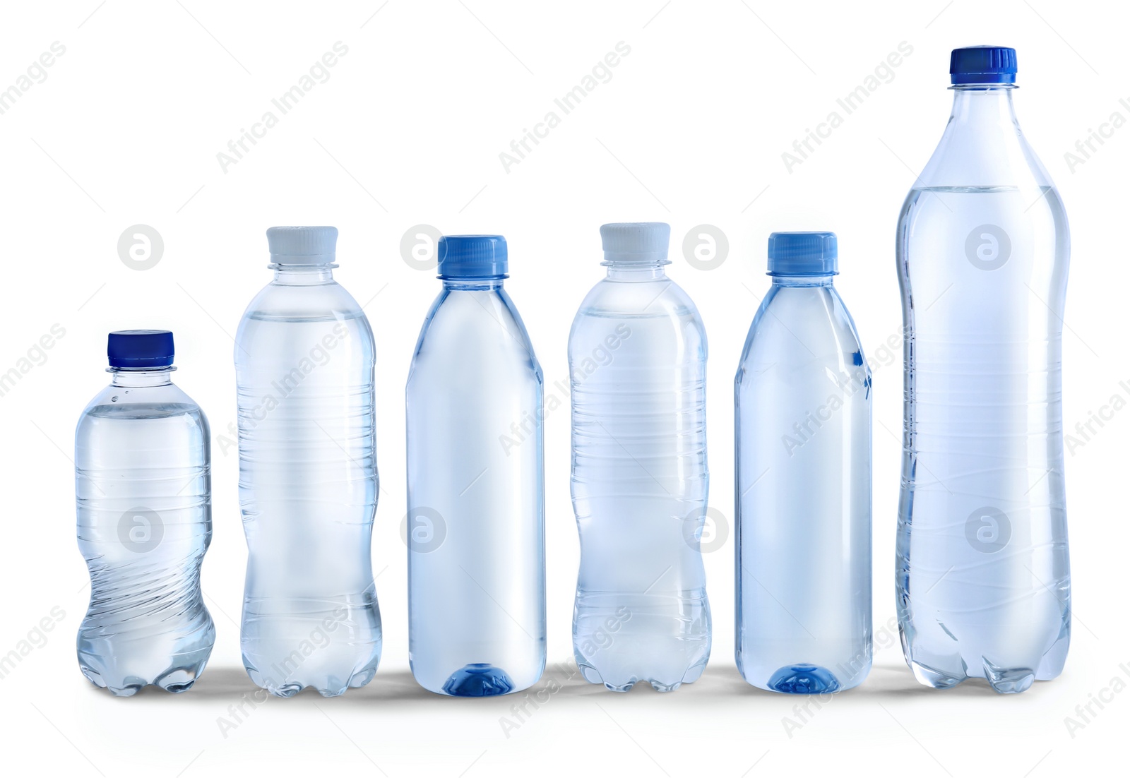 Photo of Row of different plastic bottles with water on white background