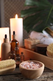 Composition with different spa products on wooden table