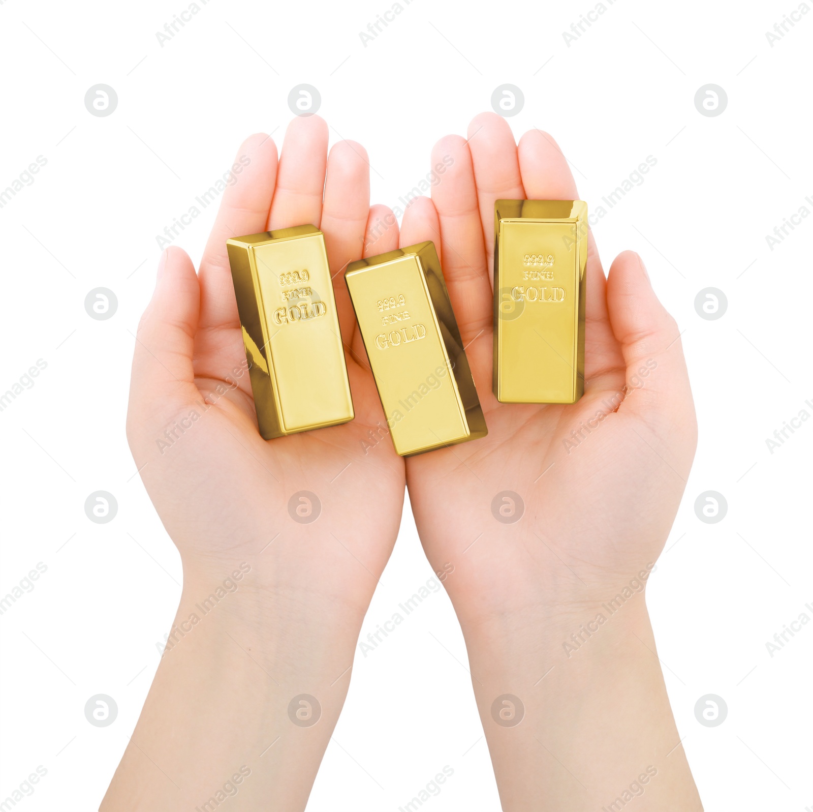 Photo of Woman holding shiny gold bars on white background, top view