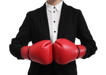 Businesswoman in suit wearing boxing gloves on white background, closeup