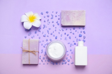 Photo of Flat lay composition with spa items on violet background