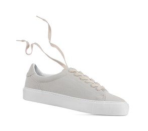 One stylish beige sneaker isolated on white