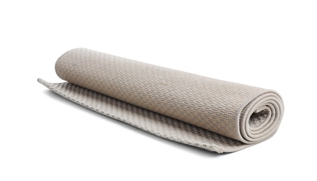 Photo of Rolled grey carpet on white background. Interior element