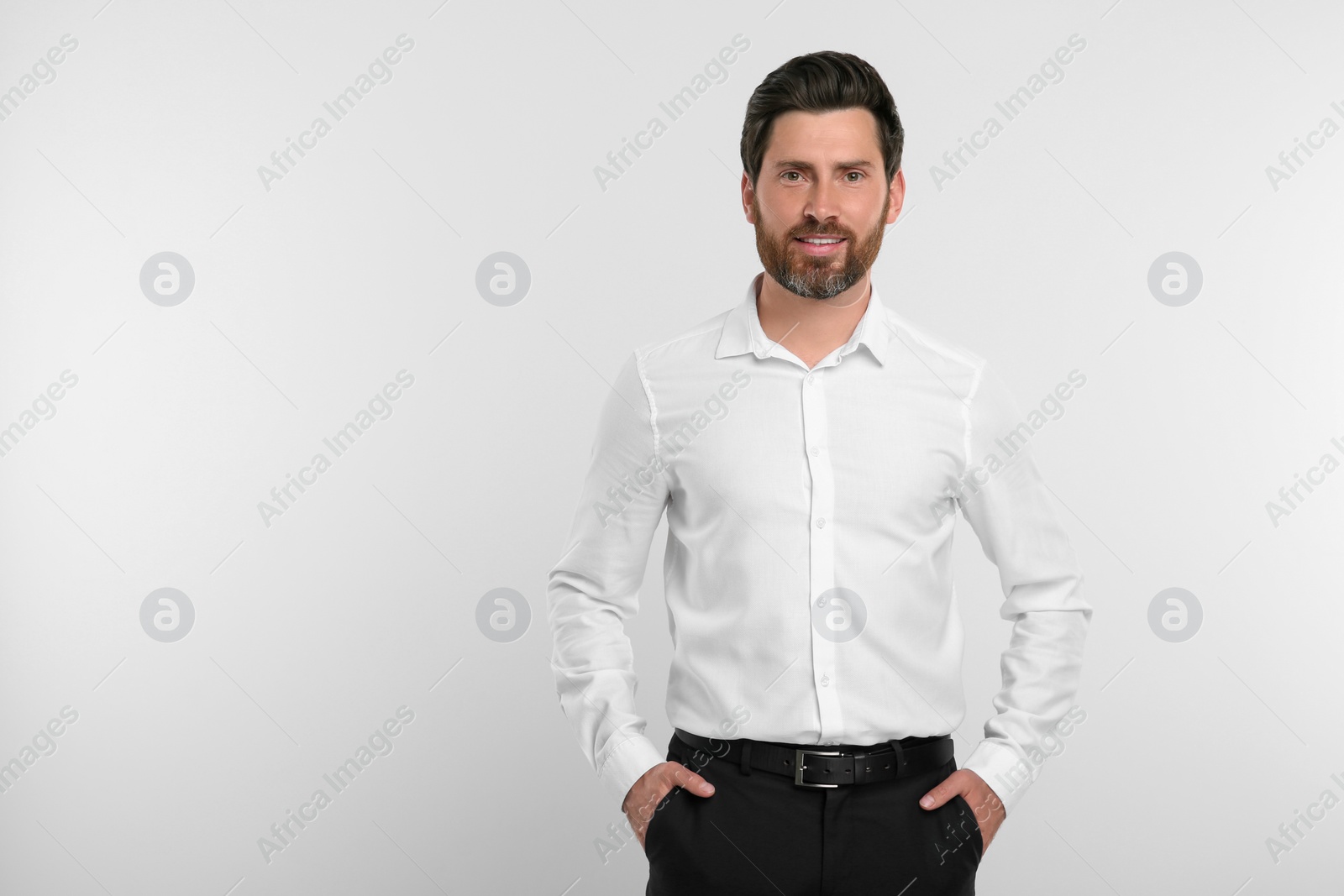 Photo of Portrait of handsome man on white background, space for text