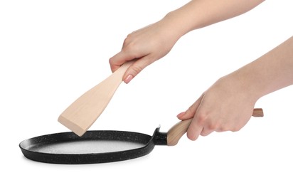 Photo of Woman with spatula and frying pan on white background, closeup