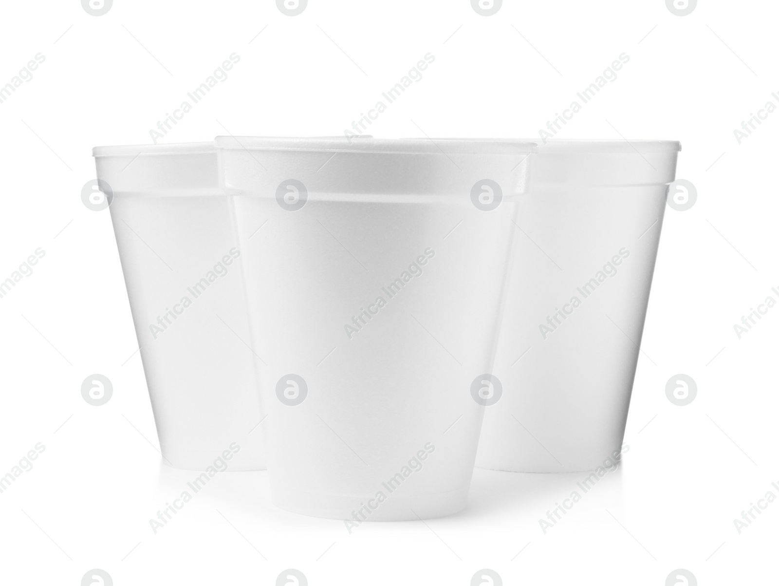 Photo of Three clean styrofoam cups on white background