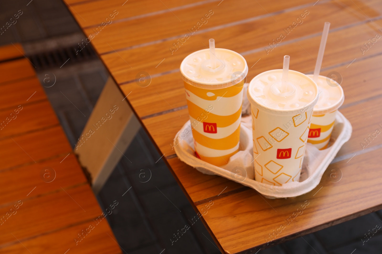 Photo of MYKOLAIV, UKRAINE - AUGUST 11, 2021: Cold McDonald's drinks on table in cafe
