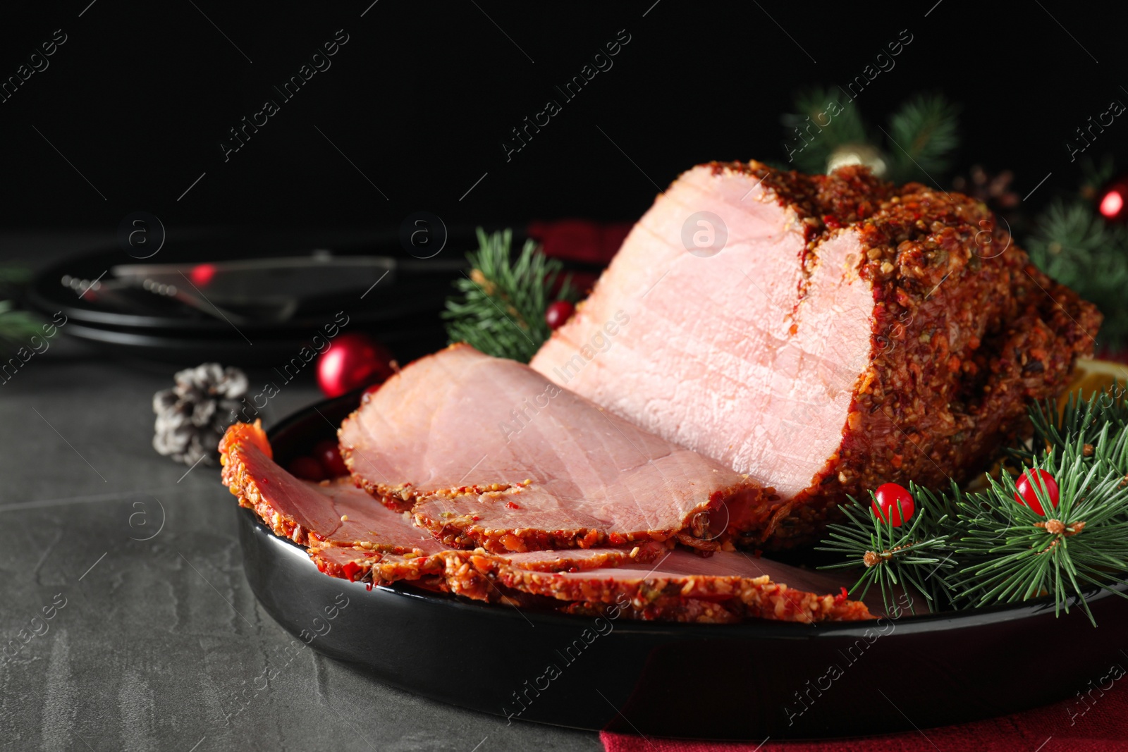 Photo of Tray with delicious ham on grey table. Christmas dinner