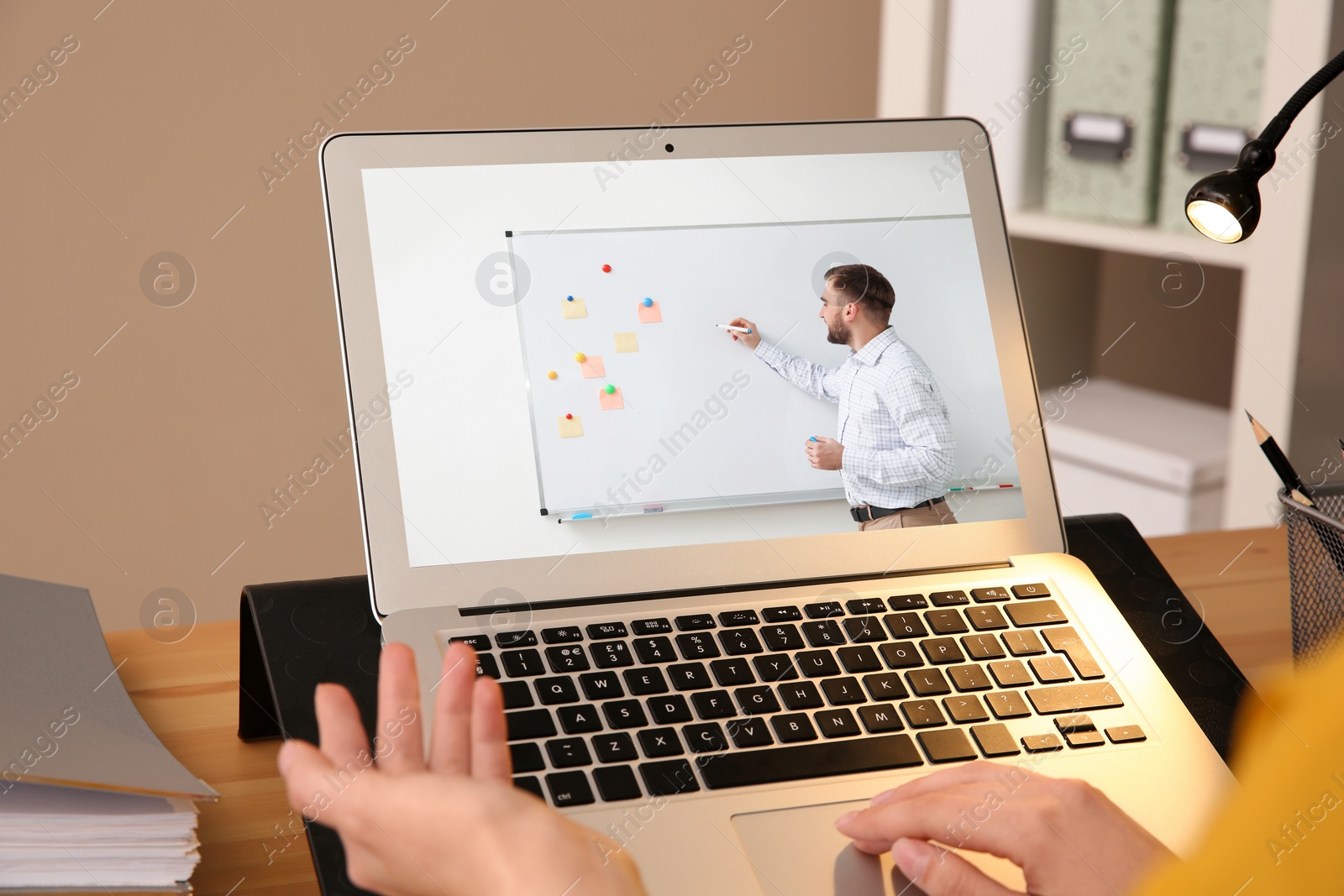 Image of Woman having online video consultation with business trainer at table, closeup