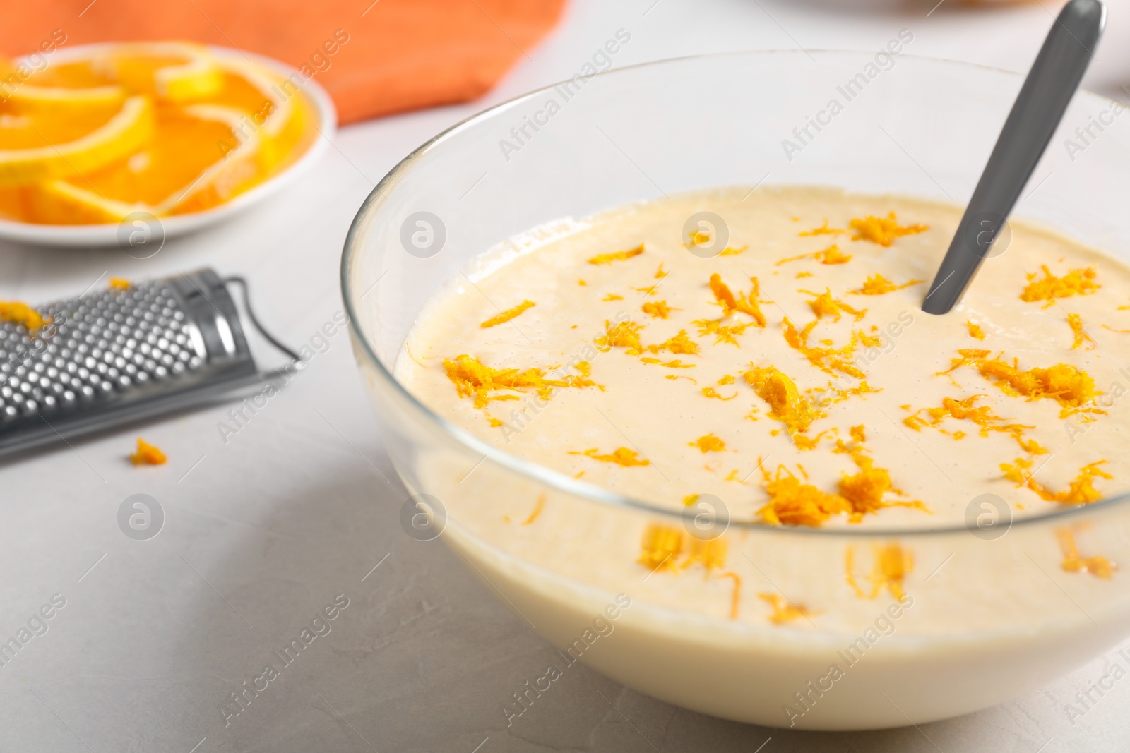 Photo of Glass bowl with batter on light table, closeup