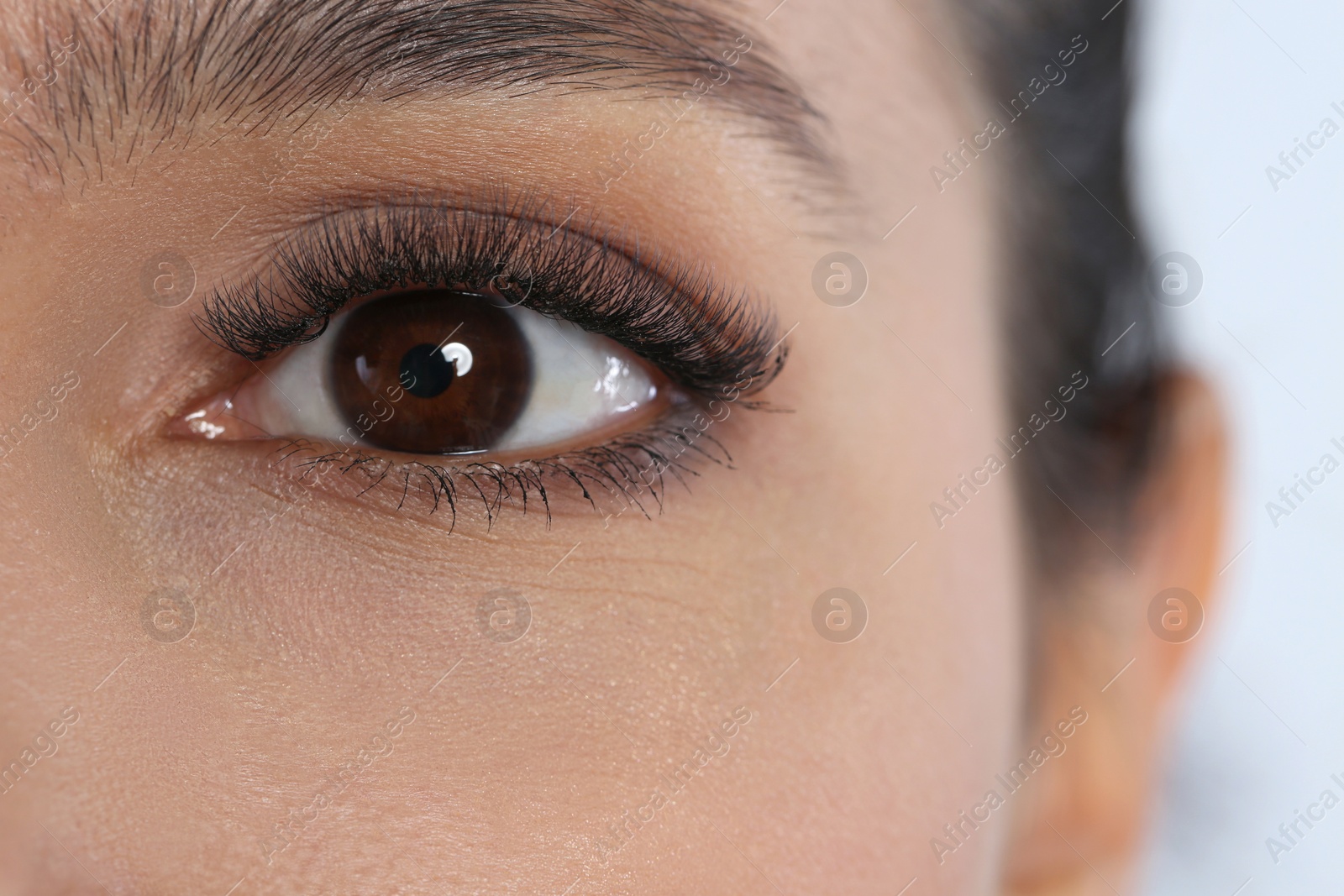 Photo of Young pretty woman, focus on eye. Visiting ophthalmologist