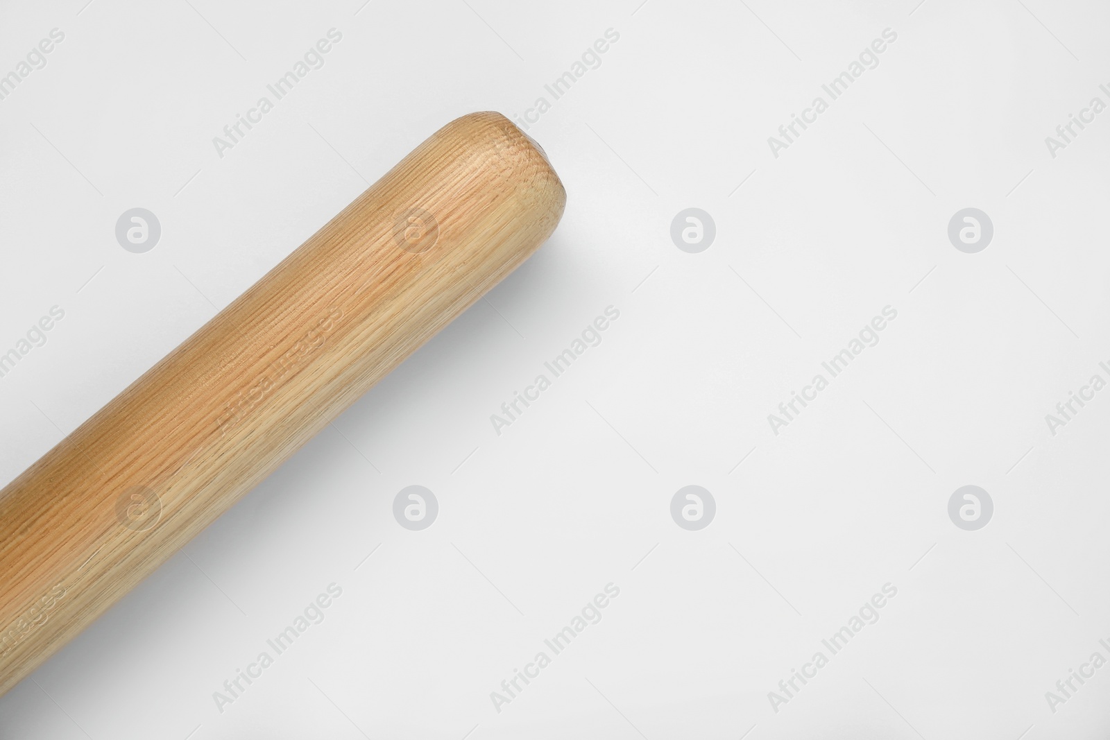 Photo of Wooden baseball bat on white background, top view with space for text. Sports equipment